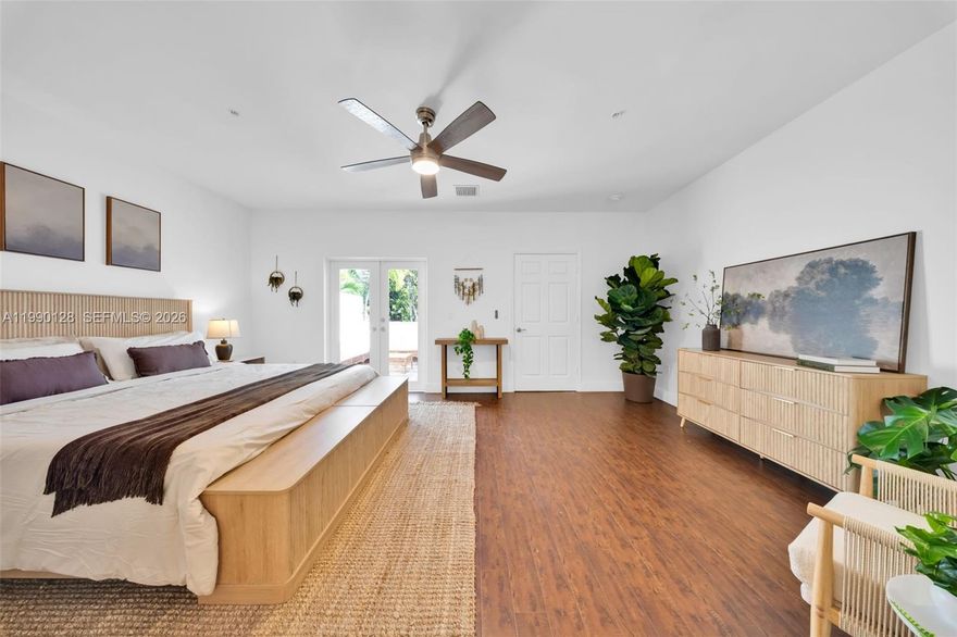 Spacious tri-level townhouse located in walkable North-East Coconut Grove. This 3 bed / 3.5 bath residence offers 2,445 SF of comfortable living, featuring a fully renovated BOHO-inspired primary suite occupying the entire third floor with a private balcony. The open kitchen includes wood cabinets, granite countertops, and stainless steel appliances, flowing seamlessly into the dining and living areas with tile flooring. Bedrooms feature en-suite bathrooms and wood floors, plus a convenient guest half bath on the entry level. Enjoy a private rear patio perfect for outdoor relaxation. Additional highlights include 2 assigned parking spaces in a gated lot, impact windows and doors, and a tri-level layout that provides privacy and space for all. Ideally situated to walk to parks, dining, shopping, and all the best of Coconut Grove.