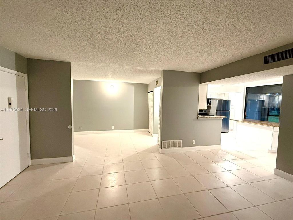 Photo of 5220 Las Verdes Cir #114, Delray Beach, FL 33484 (MLS # A11973034)