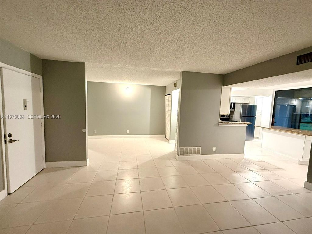 Photo of 5220 Las Verdes Cir #114, Delray Beach, FL 33484 (MLS # A11973034)