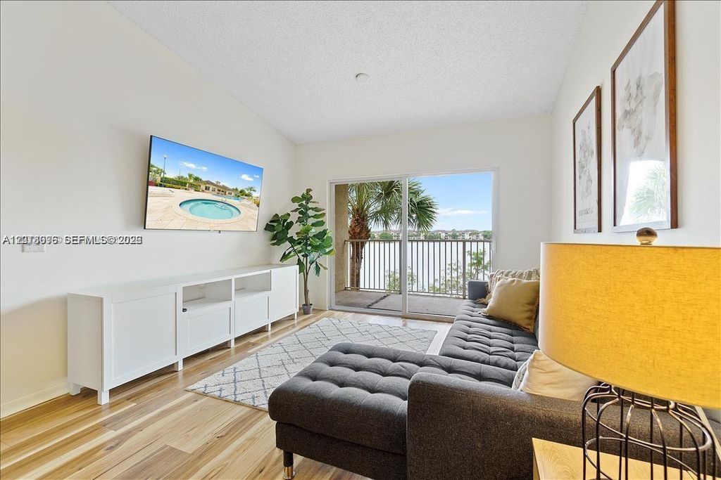 Photo of 5065 Wiles Rd #308, Coconut Creek, FL 33073 (MLS # A12018096)