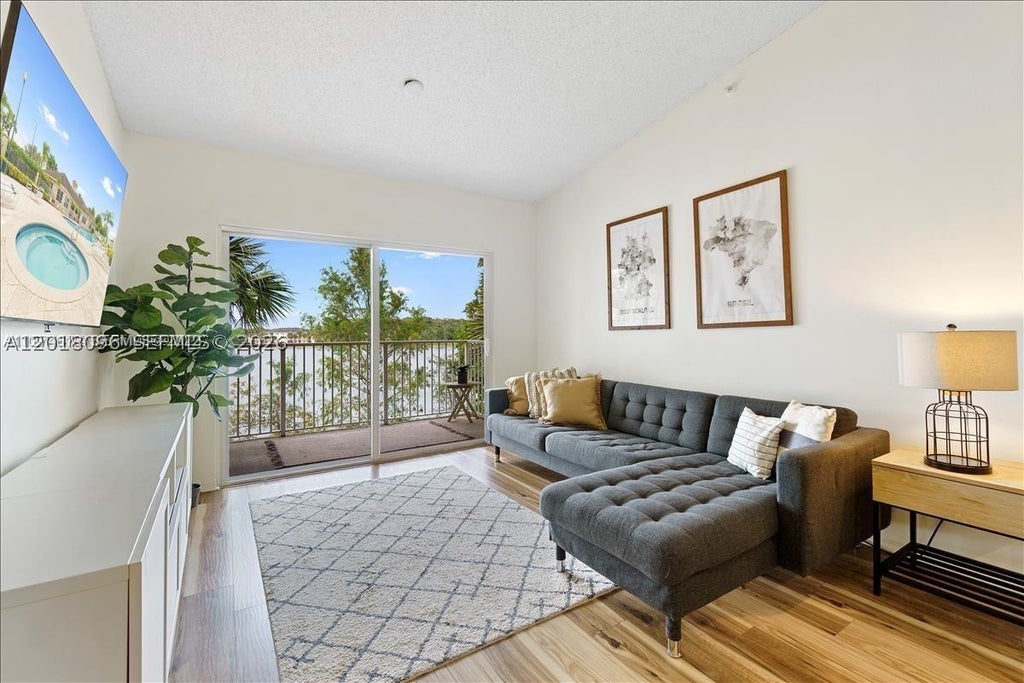 Photo of 5065 Wiles Rd #308, Coconut Creek, FL 33073 (MLS # A12018096)
