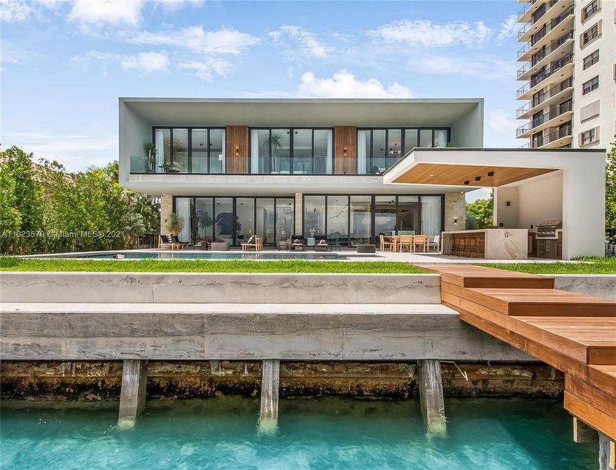 Venetian Islands brand-new waterfront with striking contemporary architecture offering 75 feet of wide bayfront and stunning water and Miami Skyline views! Walk into this dream, 6,400-SF home to find open-concept living areas with Italkraft kitchen, floating staircase, and interior courtyard – all overflown with sunlight and sparkling water views. Excellent floor plan with 2 beds down (guest & maids) and 5 large beds with en-suite baths, walk-in closets, and terraces. Spectacular master suite with lavish bath that will take your breath away! The upper family room is perfect for family gatherings and movie nights. Wood floors, high ceilings, many terraces, music system, security cameras, 2-car garage. Situated on a 11,250-SF lot on residential N Venetian. Fully completed and move-in ready