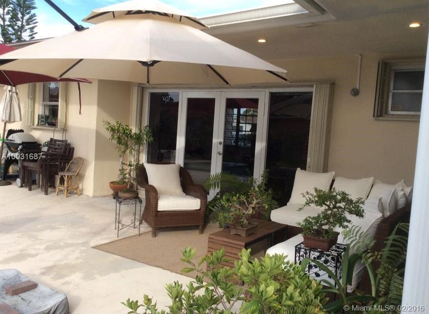 Double gated 24 hr security. Prestigious Highland Gardens 3/2 with swimming pool. Numerous upgrades. Roof 3 years new. A/C 4 ton 4 years new, accordion hurricane shutters, porcelain tile floors, huge family room, storage. All "A" schools. Easy to see.