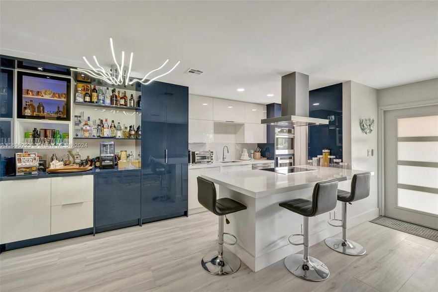 Experience this professionally curated masterpiece of design in the renovation of this incredible 2 bed 2 bath co-op. A chefs kitchen that includes FULGOR appliances from Milano Italy, Custom quartz countertops with metallic blue & white lacquered cabinetry, New $6500 AC Unit. As you entertain enjoy the dedicated bar/ storage area. High end planked porcelain tile flooring throughout. Primary suite has a walk in closet & custom bath, & the guest bath is also new with high end finishes. New impact windows/doors. Heated pool, Only 20 units, Watch the 4th's Fireworks, Christmas Boat Parade, Sea & Air show, from the spacious second floor balcony. A few blocks to Ft. Lauderdale Beach. PURCHASE THIS CO-OP WITH NO DOCKAGE FOR ONLY $450,000 !