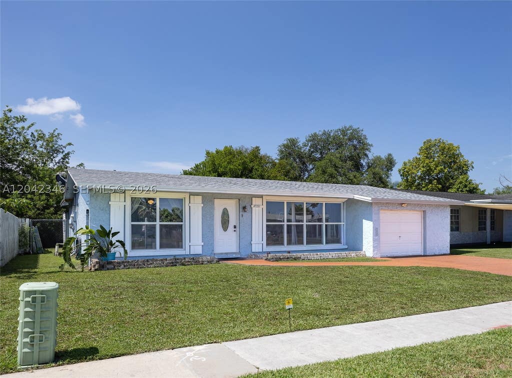 Photo of 8350 NW 27th Pl, Sunrise, FL 33322 (MLS # A12042346)