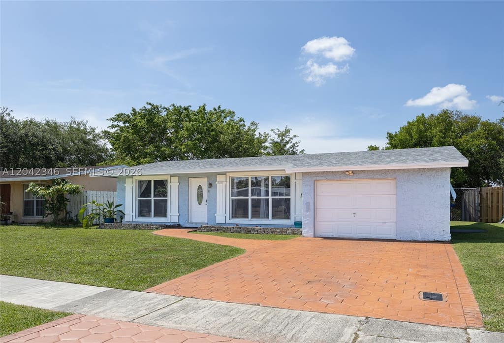 Photo of 8350 NW 27th Pl, Sunrise, FL 33322 (MLS # A12042346)