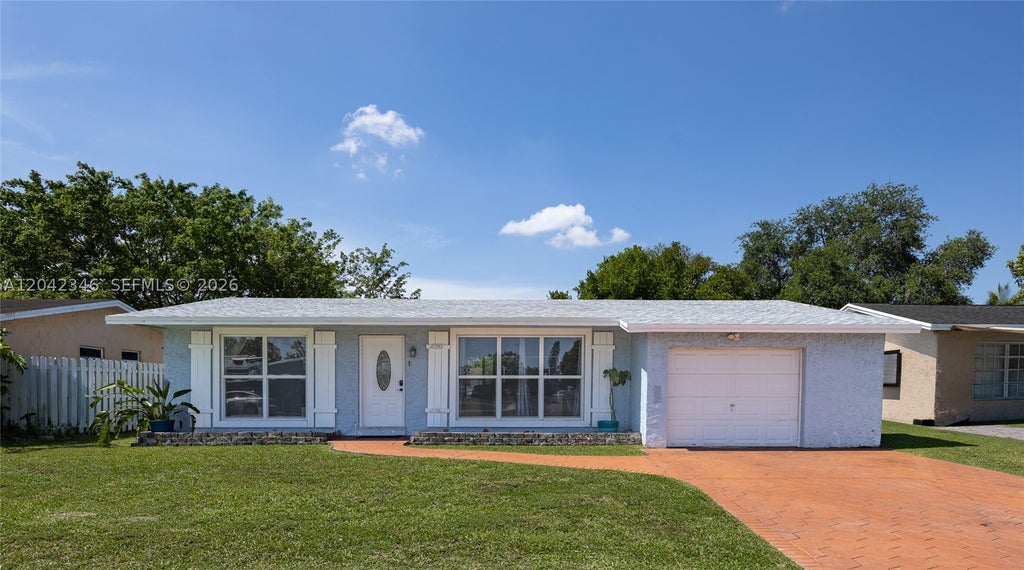 Photo of 8350 NW 27th Pl, Sunrise, FL 33322 (MLS # A12042346)
