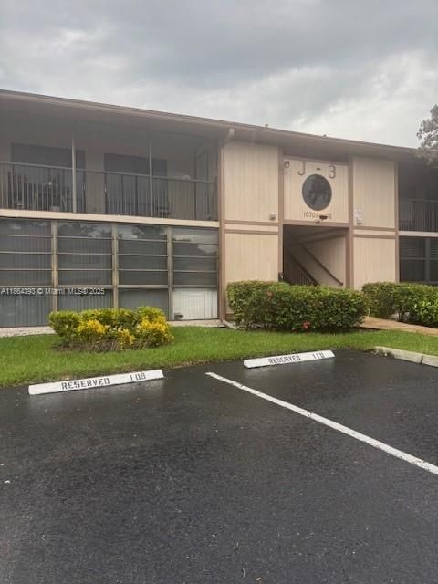 Photo of 10709 W Clairmont Cir #111, Tamarac, FL 33321 (MLS # A11864393)