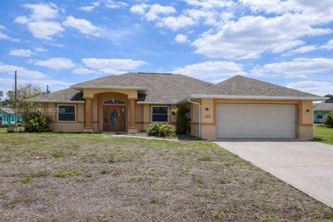Photo of 825 Costa Pl, Lehigh Acres, FL 33972 (MLS # A11999081)
