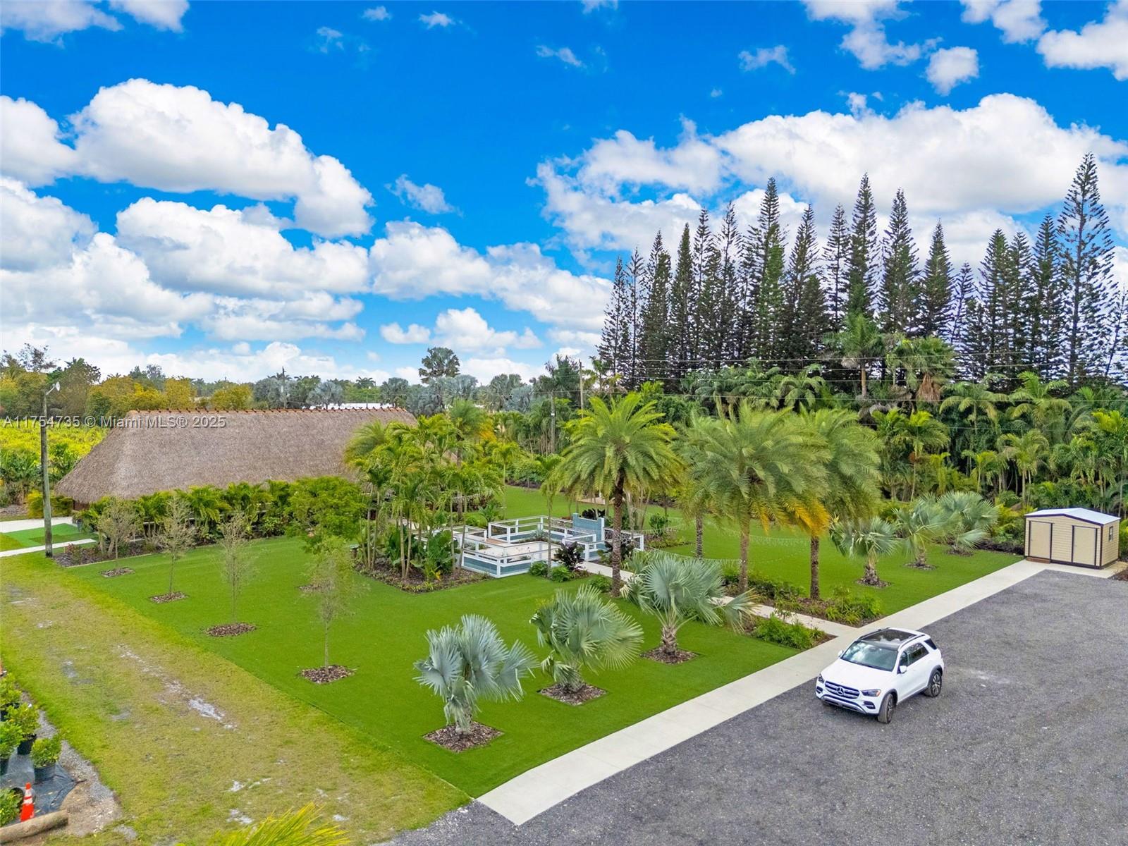 Outstanding 5 acres of land sit in a corner lot. The property at this time is use as a nursery with full irrigation system, water, two wells. In addition, the property have a 40' x 30' Ticket Hub that could sit up to 120th people and produce income as outdoor activity place where could be rented to celebrate weddings, birthdays, dances and others activities. Property have 70 parking spot. wifi ready, security cameras, automatic timers, 2 bathrooms with air conditioner. Water falls, synthetic grass, storage room, two main 20 feet wide as main entrance. Completly fence. Could be use as an recreational bussines spot and also could become a trucks parking lot creating a great potential income. Showings by appointment only.. Plants are not included in the sale.