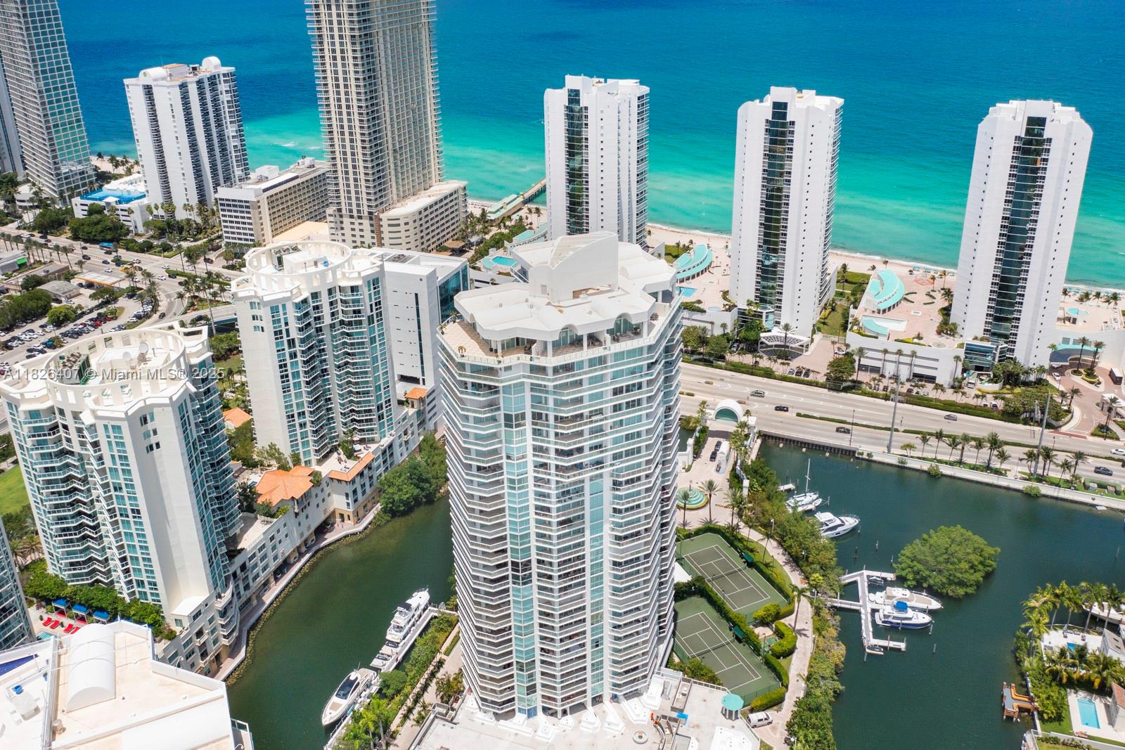 Fully and Highly Renovated Resort living panoramic views from this 2BR, 2BA + den condominium on the 18h floor of Oceania Island, Tower IV. SPECIAL ASSESMENT PAID BY THE SELLER. Extra large wrap-around balcony overlooking the bay, ocean, and the Miami Beach skyline with South West exposure. Condo is fully renovated floor-to-ceiling windows with electric blinds, full size , all new appliances. Immaculate condition w custom closets and extra designer built-ins, gym, exercise classes & personal training . Beach amenities include lounge chairs, umbrellas, and towel service. Relax at the bar or take advantage of the complete spa services, salon, massage, & facials. Resort Living one of the high ends on Sunny Isles. Close to Shopping plazas, Aventura, Ball Harbor mall and restaurants.