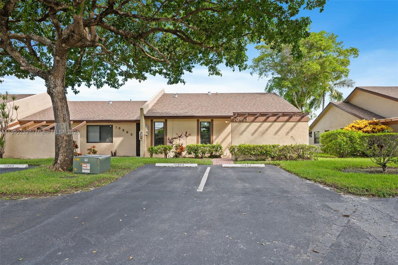** TURN-KEY 2 bedrooms and 2 bathrooms end villa with modern upgrades ** IMPACT windows/doors ,FULLY REMODELED KITCHEN(2022) with custom made wood cabinets, pantry with pull-out trays, granite countertops, stainless steel appliances. Kitchen sliding door opens to outdoor seating, ideal for your morning coffee. Front load washer and dryer. Tiled floor in living areas, quality laminate in bedrooms. 220-volt line in front of house, stacking sliding doors in living room open to enclosed EXTENDED PATIO with hot tub, serene water views. HVAC, smart thermostat (2021). Renovated main bath (2021). Storage, two front-parking spaces. Roofs replaced 2023.**NO PENDING ASSESSMENTS, LOW HOA**All-ages community, immediate rentals allowed, 1 pet up to 25 lbs. Quiet location near shopping, dining, highways
