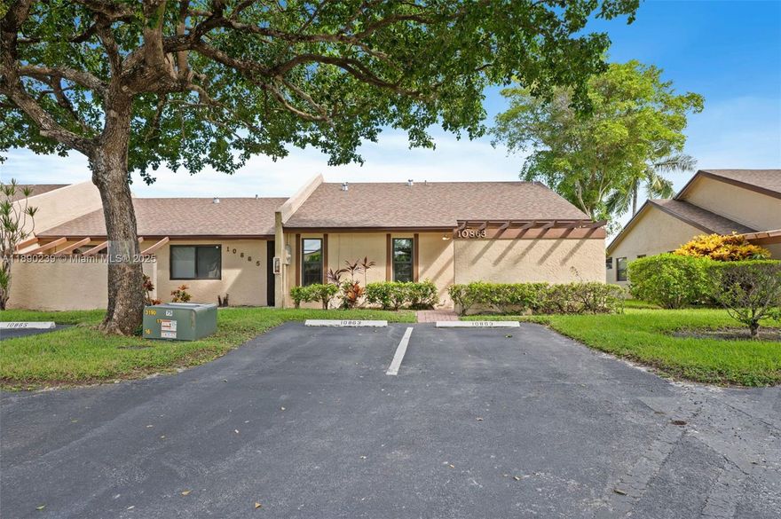 ** TURN-KEY 2 bedrooms and 2 bathrooms end villa with modern upgrades ** IMPACT  windows/doors ,FULLY REMODELED KITCHEN(2022) with custom made wood cabinets, pantry with pull-out trays, granite countertops, stainless steel appliances. Kitchen sliding door opens to outdoor seating, ideal for your morning coffee. Front load washer and dryer. Tiled floor in living areas, quality laminate in bedrooms. 220-volt line in front of house, stacking sliding doors in living room open to enclosed EXTENDED PATIO with hot tub, serene water views. HVAC, smart thermostat (2021). Renovated main bath (2021). Storage, two front-parking spaces. Roofs replaced 2023.**NO PENDING ASSESSMENTS, LOW HOA**All-ages community, immediate rentals allowed, 1 pet up to 25 lbs. Quiet location near shopping, dining, highways