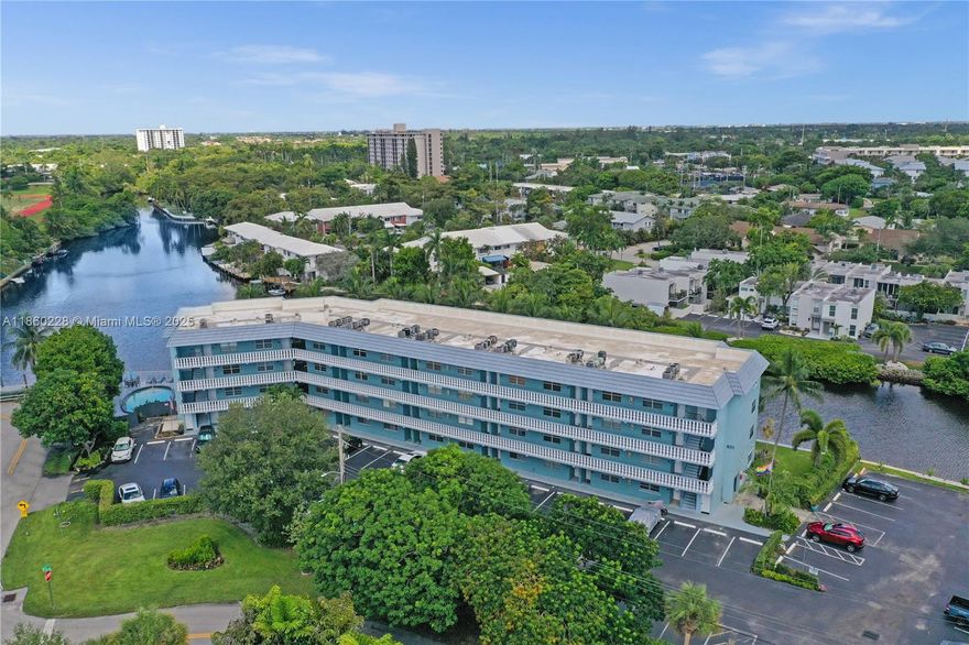 Price Improvement! Serene & tranquil Camelot Shores! Your waterfront, South Florida lifestyle in the middle of everything you love! This 1 bed, 1 bath condo is completely renovated with impeccable style. Italian porcelain floors, quartz counters, custom cabinetry, SS appliances, & 2021 AC, make for ease of living, & entertaining. The bedroom features a large closet, impact windows, and a beautiful bathroom, with deep soaking tub & shower combo. The waterfront view from your personal screened balcony is breathtaking! Perfect for your morning coffee, or enjoy the daily sunsets, with a glass of wine. Enjoy a swim in the pool. Restaurants & nightlife of Wilton Manors, Ft. Lauderdale, Las Olas, & the Beaches, are minutes away! Condo has completed all its requirements. GREAT VALUE, MUST SEE!!