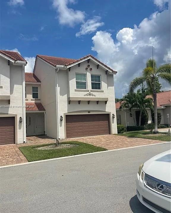 Well-maintained 3-bed, 2.5-bath townhome with attached 1-car garage in gated Greenwood Villas. This end-unit offers 1,800+ sq. ft. of living space, tile floors downstairs, carpet upstairs, and a screened lanai with peaceful preserve views. The open-concept kitchen features granite counters, stainless steel appliances, a pantry, and breakfast bar. All bedrooms, laundry, and a versatile loft are upstairs, including a spacious primary suite with dual closets. Amenities include a resort-style pool, fitness center, dog park, and clubhouse. Located minutes from FGCU, RSW, I-75, and Gulf Coast Town Center.