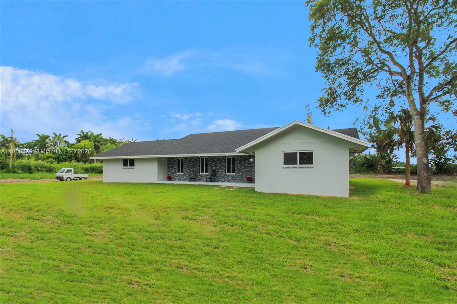 Modern, sexy, & sitting pretty on 2.5 lush acres—this Miami stunner is the ultimate private retreat. Fully remodeled w/ a brand-new roof, sleek finishes, and airy vibes throughout. The kitchen? A showpiece. The primary suite? Pure bliss. Tucked away but close to everything, this home is where luxury meets freedom. Bold style, wide-open space surrounded by nature with all the room you need to live your life in peace. Want a pool, a guest house, a mini farm, or space for your toys? Go for it—it’s ag-zoned and ready for your wildest ideas . The 2.5 car garage can easily house all your boats & toys!! This property is a blank slate to create the masterpiece of your dreams. A rare opportunity to design your ideal lifestyle in a sleek, modern sanctuary all your own.