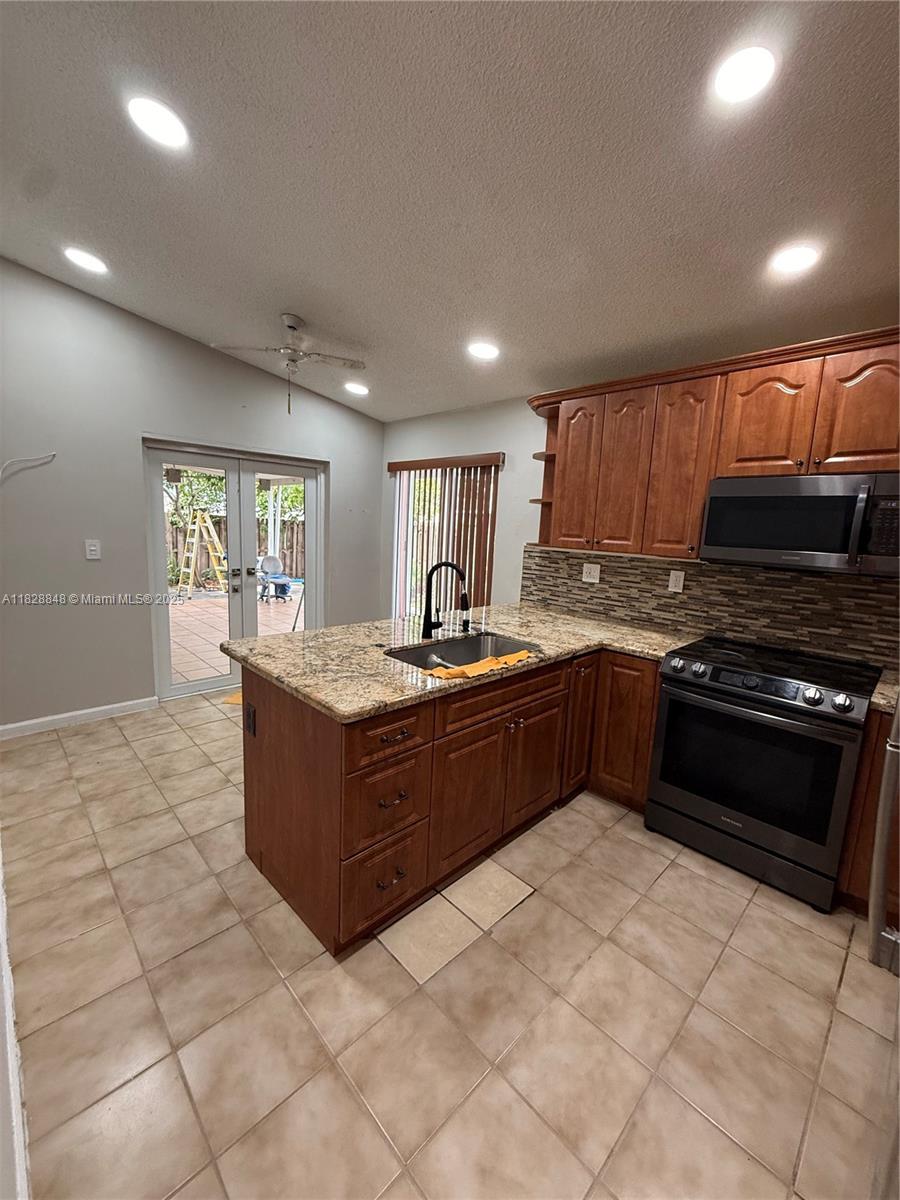 Welcome to 19926 NW 67th Pl — a spacious 4-bedroom, 2-bathroom home in a desirable Northwest Miami location near Miami Lakes. This well-maintained property features an updated kitchen with granite countertops, ample living space, and a large side yard with a private entrance—perfect for a boat, RV, or future guest suite. Centrally located near schools, shopping, and major highways, this home offers convenience, comfort, and flexibility for growing families or investors alike. Don’t miss this opportunity!