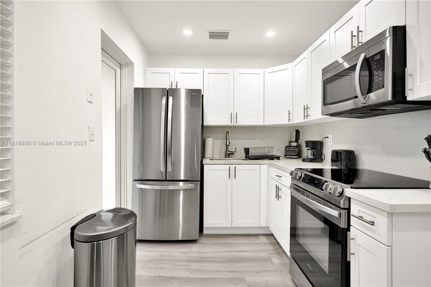 Fully Furnished & Move-In Ready! Step into this beautifully updated 2-bedroom unit featuring modern finishes, a sleek kitchen with stainless steel appliances, and stylish vinyl plank flooring throughout. Not only does it offer you the peace of mind that comes with being in a gated home but it also comes fully furnished with chic decor, a smart layout, and a washer/ dryer. Enjoy the convenience of free Wi-Fi and water included in rent—no extra bills to worry about! Perfect for a professional, student, couple, or small family looking for a clean, quiet, and turnkey rental in the heart of Miami. Fast approval, easy access to major highways, and just minutes from Design District, Midtown & Wynwood. Don't miss out !!