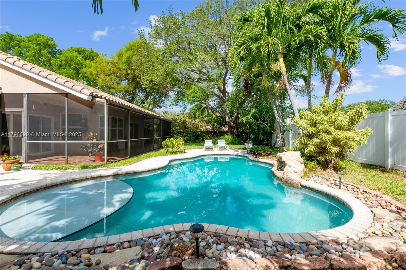 Step into comfort & charm with this inviting 3-bed, 2-bath home located in the sought-after Ivanhoe at Hawkes Bluff in W. Davie. Situated on an oversized corner lot, the property boasts a private 6’ fenced yard, a sparkling saltwater pool with sun shelf, & a certified butterfly garden, perfect for outdoor living and relaxation. Inside are spacious living areas ideal for entertaining & everyday family life. The split floor plan offers privacy with the primary suite having direct access to the patio & pool. Additional highlights include solar panels & impact windows for energy efficiency & storm protection, & a 14-year-old tile roof. Nestled in the interior of the community & close to Hawkes Bluff School, this home offers the perfect blend of comfort, privacy, & convenience.