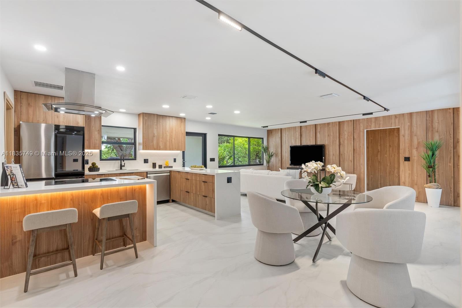 OPEN HOUSE AUG 23rd - 12-2pm - Step into sleek sophistication at this fully renovated modern oasis in Fort Lauderdale. Permitted from driveway to fence, this home features a custom Italian kitchen with quartz counters, premium Thor, Samsung & Bosch appliances, and smart home upgrades throughout—including Nest thermostat, rotating TV, and smart bathrooms. Enjoy panoramic pool views through expansive glass doors, a screened resort-style pool with marble deck, a cabana bath, and a built-in Weber grill zone. All-new plumbing, electrical, HVAC, impact windows, and custom finishes—down to magnetic-lock doors and designer closets. Located minutes from Lauderdale-by-the-Sea, this turnkey stunner is luxury redefined.