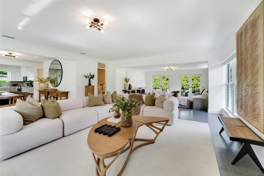 Beautifully renovated and professionally staged, this 3-bedroom + den, 3-bath home is tucked away on a quiet, tree-lined cul-de-sac in Miami Shores. The bright and open layout offers multiple living areas with large windows that fill the home with natural light. Every space has been thoughtfully updated to blend comfort, functionality, and modern style, creating a warm and inviting atmosphere the moment you step inside.

The beautifully remodeled kitchen and bathrooms feature clean finishes and timeless design, while a mix of wood and tile flooring adds character throughout the home. The converted garage, complete with a private entrance and full en-suite bathroom, offers exceptional flexibility—perfect for guests, extended family, a home office, or a private suite. Two additional bedrooms plus a spacious den that can serve as a fourth bedroom share a well-appointed third bathroom, giving the home a versatile layout that works for many living situations.

Situated on an oversized lot, the property offers ample room to add a pool, allowing you to create your own private outdoor oasis or further enhance the home’s value. The backyard provides generous space for entertaining, gardening, or future customization. Move-in ready and located minutes from Miami Shores Country Club, top-rated schools, the Bay, shopping, dining, and more, this home combines charm, thoughtful updates, and incredible potential in one of Miami’s most desirable neighborhoods.