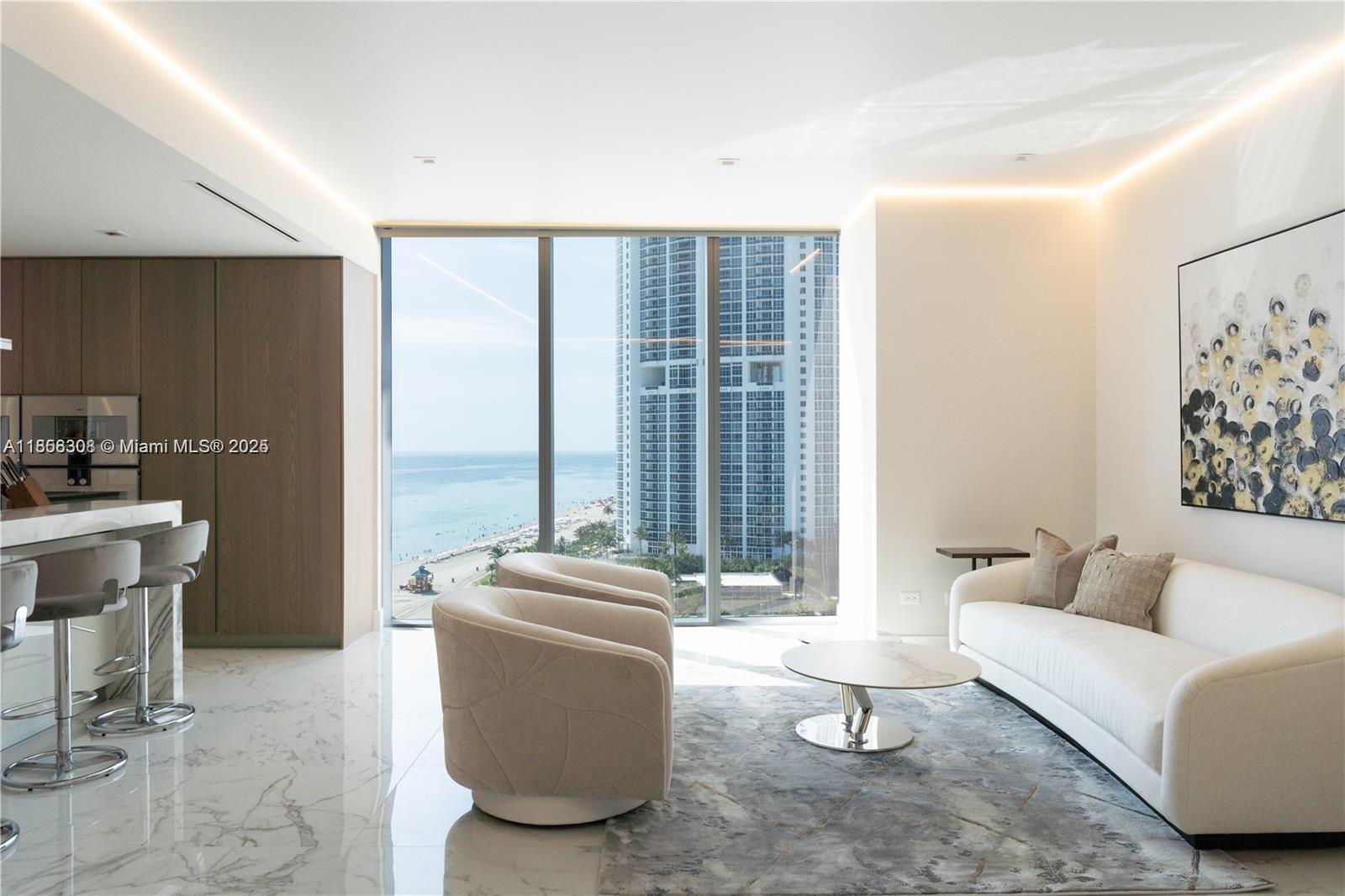 Live the ultimate beachfront lifestyle in this furnished 4-bedroom + den, 5.5-bath flow-through corner residence at the prestigious Turnberry Ocean Club. Enjoy breathtaking direct ocean and Intracoastal views from floor-to-ceiling glass and expansive terraces. This home features designer finishes, top-of-the-line appliances, and an elegant, open layout perfect for entertaining. Turnberry Ocean Club offers six full floors of amenities, including private beach service, three swimming pools, state-of-the-art fitness center, spa, private dining, and entertainment areas. Experience world-class luxury living in the heart of Sunny Isles Beach.