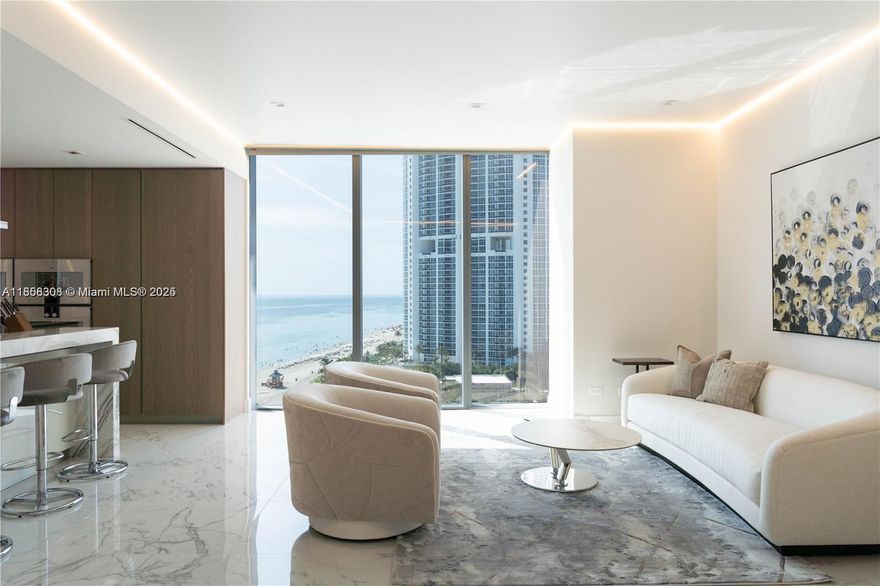 Live the ultimate beachfront lifestyle in this furnished 4-bedroom + den, 5.5-bath flow-through corner residence at the prestigious Turnberry Ocean Club. Enjoy breathtaking direct ocean and Intracoastal views from floor-to-ceiling glass and expansive terraces. This home features designer finishes, top-of-the-line appliances, and an elegant, open layout perfect for entertaining. Turnberry Ocean Club offers six full floors of amenities, including private beach service, three swimming pools, state-of-the-art fitness center, spa, private dining, and entertainment areas. Experience world-class luxury living in the heart of Sunny Isles Beach.