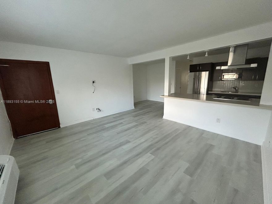 Great Location 3 blocks from beach, Renovated recently painted, new flooring ground floor unit in fourplex. Tranquil Carlyle and 74 .  Well priced, must see.