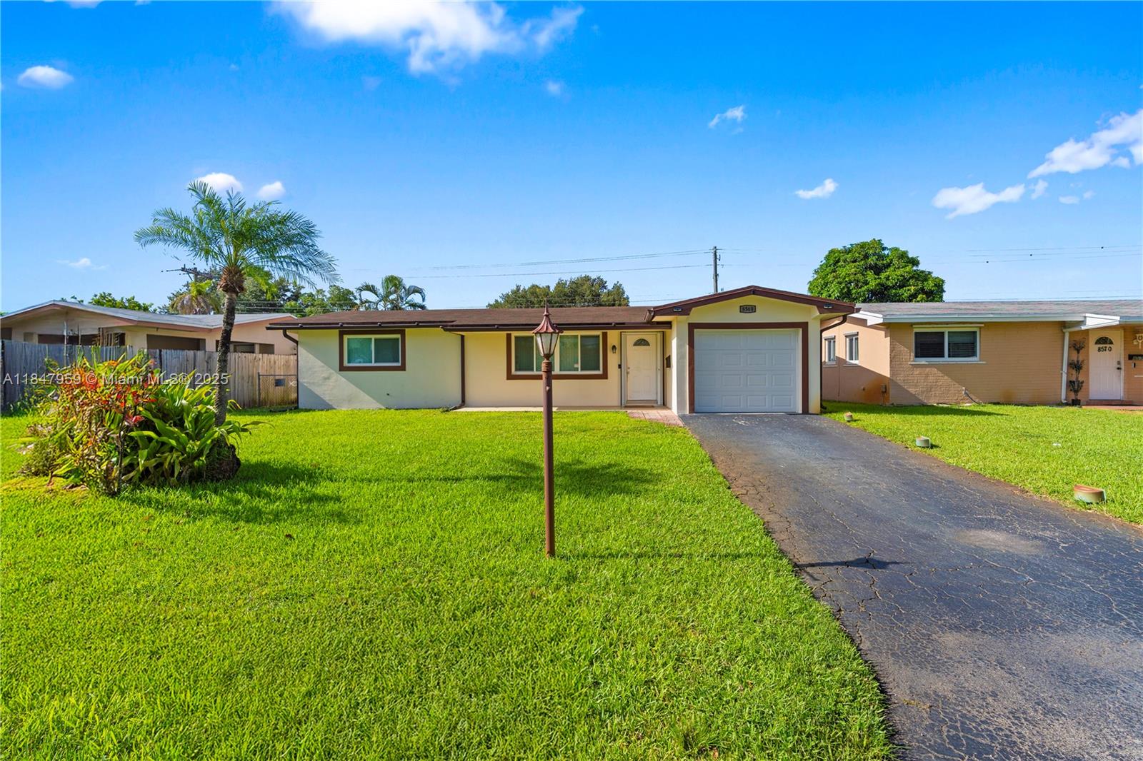 Shows like new, Light & bright, Recently remodeled, Modern and open floor plan, Impact windows, Updated kitchen cabinets, Quartz countertops, Updated appliances, Island counter and snack bar, Updated bathroom, Hi-hat lighting, Updated AC, Upgraded electrical panel, Tile floor throughout except for wood laminate in the bedrooms, Inside laundry room, Upgraded washer & dryer, Front & rear doors have accordion shutters, Hurricane rated garage door, Large screened porch, Fenced yard