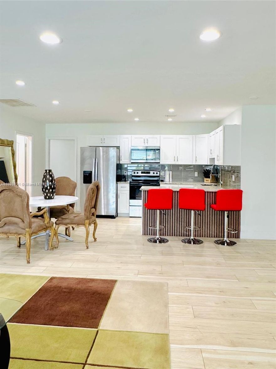 Beautifully updated and tastefully furnished unit just minutes from the beach! This elegant triplex features a shared pool and includes internet, water, sewer, pool maintenance, landscaping, and furnishings for effortless living. Ideally located within walking distance to an elementary school and close to fine dining, boutique shops, and the beach, offering the perfect blend of comfort, style, and convenience in desirable Deerfield Beach.
