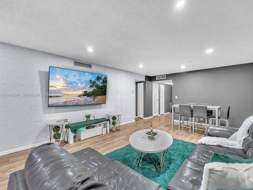 Experience elevated living in this beautifully 2-bedroom, 2-bath residence in the sought-after Falls of Inverrary. This spacious condo showcases sleek laminate flooring throughout the main living areas, a contemporary kitchen with stainless steel appliances, and upgraded bathrooms featuring elegant finishes and modern design. Expansive windows frame tranquil pool and lush garden views, creating a serene retreat right at home. Thoughtfully updated and impeccably maintained, this move-in-ready residence offers both comfort and sophistication in a well-established community.