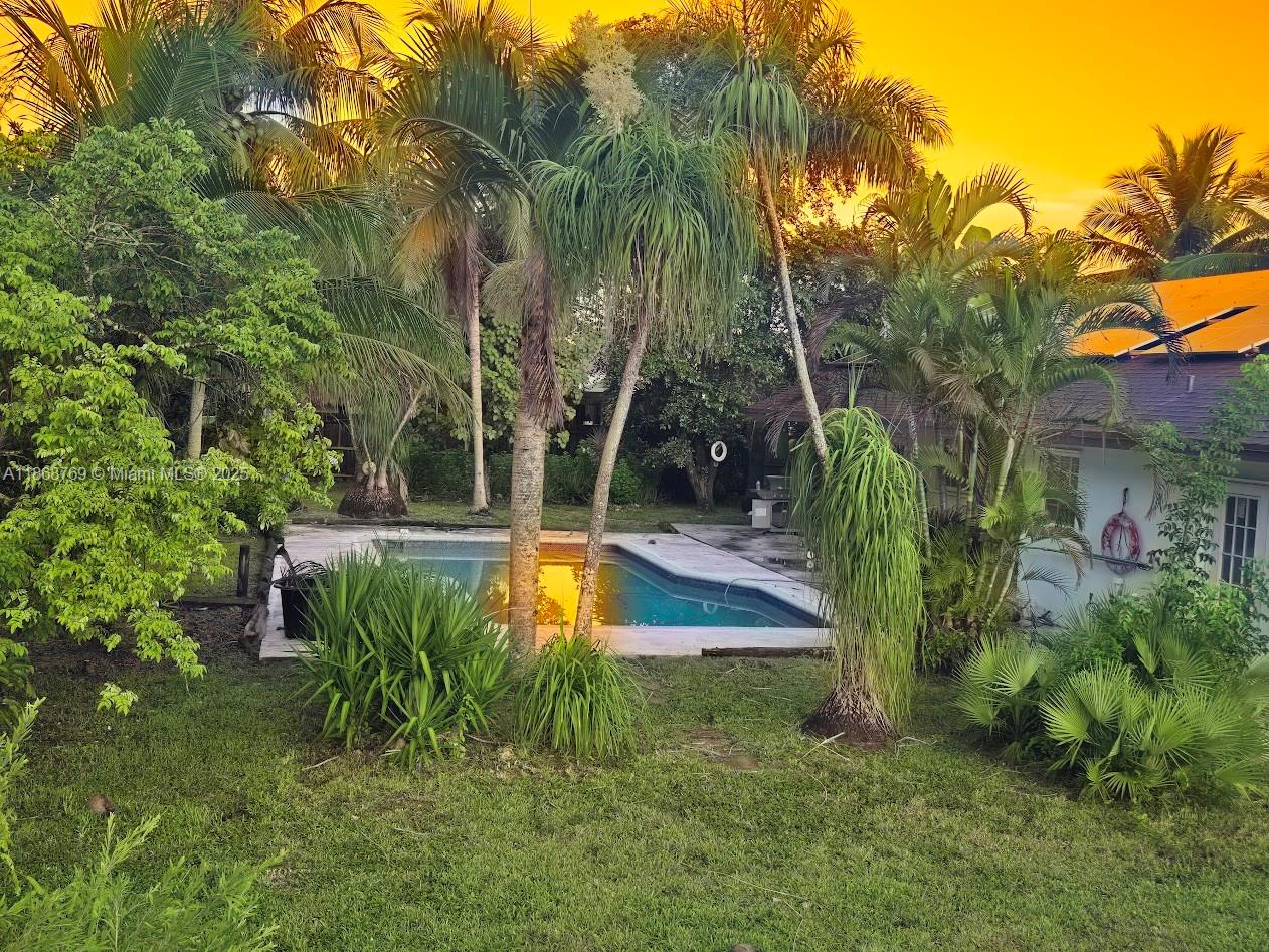 This fine home is in an amazing community and has it all, 4 bedrooms, 2 bathrooms, 2 car garage, high ceilings, updated kitchen all sitting on a fenced 1/2 acre corner lot, This property is loaded with fruit trees and best of all has solar panels installed. This is a steal at this price because she needs some updates and TLC. Call the listing agent to see it today.
