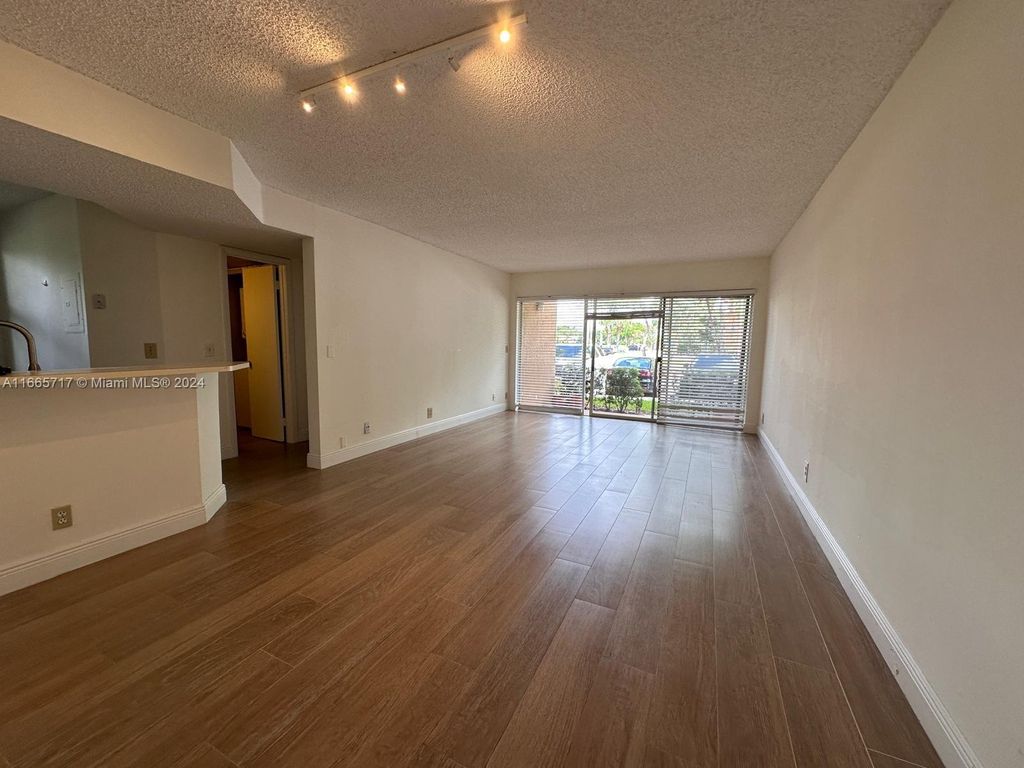 Photo of 8891 Wiles Rd #101, Coral Springs, FL 33067 (MLS # A11665717)