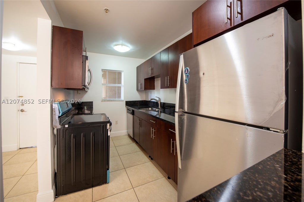 Photo of 4147 Stirling Rd #406, Dania Beach, FL 33314 (MLS # A12074852)