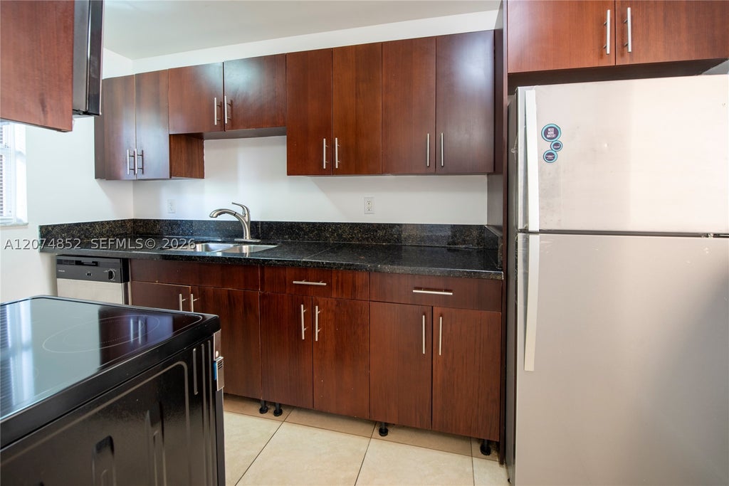 Photo of 4147 Stirling Rd #406, Dania Beach, FL 33314 (MLS # A12074852)