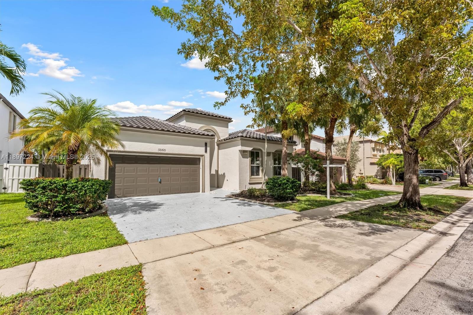 BRAND NEW ROOF + AC | Fully Renovated | Resort-Style Living. Skip the big-ticket worries, this home already has a brand-new roof and brand-new AC. Inside, fresh paint, smooth ceilings, recessed lighting, and designer fixtures create a modern, airy vibe. The kitchen shines with an extended quartz snack bar, stainless steel appliances, and open flow to the living spaces. Bathrooms are stylishly updated, and even the garage boasts a new motor and full service. All of this is in a gated, 24/7 monitored community loaded with amenities: resort-style pool, kiddie pool, spa, fitness center, basketball and tennis courts, pickleball, playgrounds, fishing dock, and more; All minutes from I-75, the Turnpike, top-rated schools, and endless shopping. Move in, unpack, and start living your dream.