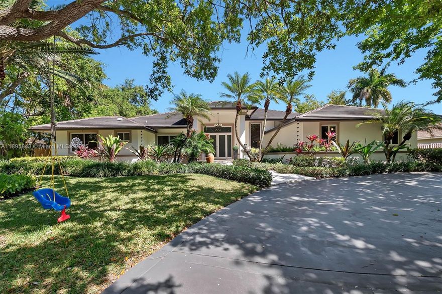 Spacious 5 bd/ 4 bath home on a wonderful tree-lined street in Palmetto Bay. Fabulous formal living & dining rms w/ volume ceilings. Impact windows. True chef’s kitchen w/ gas stove, double wall ovens, wine coolers, ice maker & oversized eat-in island, opens to family rm w/ fireplace. Marble & wood floors. Nicely sized guest bdrms, 1 bdrm & full bath separate, perfect for an office. Grand primary suite w/ walk-in closets, bath w/ dual sinks, vanity, jetted tub, water closet. Fenced yard w/ deep covered terrace, remodeled, heated saltwater pool & spa plus covered summer kitchen area. Beautifully manicured landscaping. New central vacuum, security system. Newer AC units, ductwork & insulation. Circular driveway & 2 car side entry garage. A quick golf cart ride to Starbucks, Deering Estate.