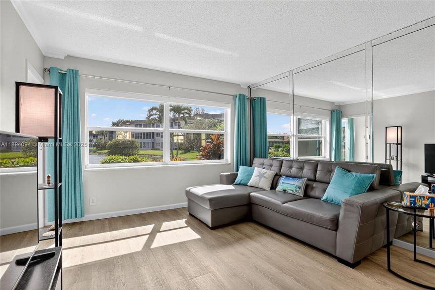 Charming and beautifully renovated 1-bedroom condo on the first floor, featuring a Florida room that can easily be converted into a second bedroom. Enjoy peaceful views of the lake and pool right from your home. Fully furnished with stylish décor and stainless steel appliances—just bring your suitcase and move in! This friendly HOPA community offers great amenities including a pool, gym, BBQ area, shuffleboard, library, and clubhouse, plus a lovely gated backyard.Intenet is included in the monthly fees. Perfectly located near the Turnpike, grocery stores, and Walmart.