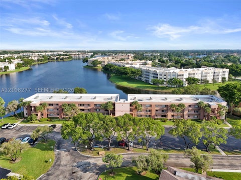 Photo of 7466 Ashmont Cir #303, Tamarac, FL 33321 (MLS # A12108277)