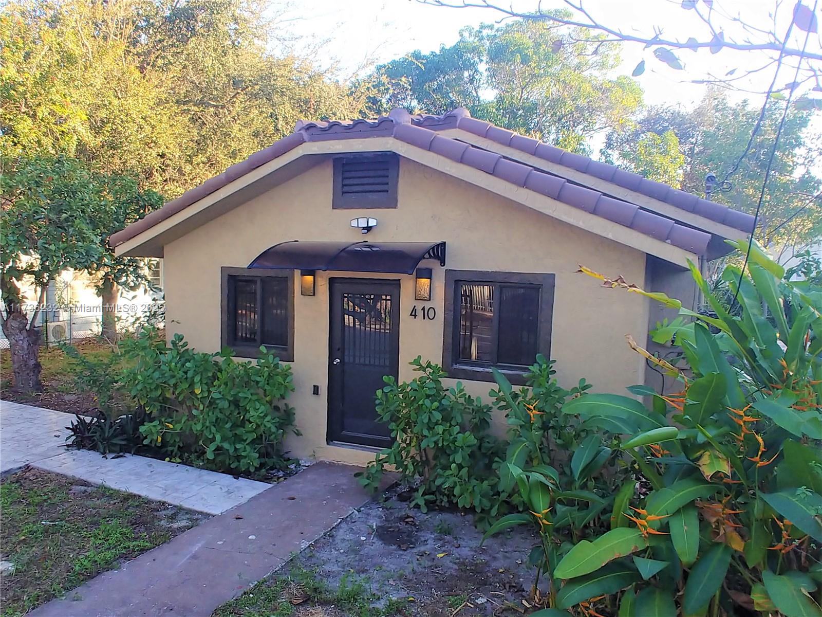 4 bedroom 2 bath single family home in Buena Vista West. 1,247 SF per appraisal. 4 bedrooms for a 3 bedroom price! Tenant occupied paying $3,874 per month until 3/27/25. Insurance with wind is only $3,050 due to new roof and hurricane windows. Renovated kitchen with new stainless appliances & quartz countertops. Updated baths. New tile roof under warranty that can be transferred to the buyer. New hurricane windows & glass doors. Gated parking for two cars. Yard has a shed & room to store a boat or RV. Tile throughout, central AC & heat & ceiling fans. Laundry hookups in a closet in the rear bedroom. Avocado & mango trees. Yard has room for an addition, deck, swimming pool. Property is zoned "0104 SINGLE FAM - ANCILLARY UNIT" which allows for a 2nd unit to be built. owner/agent
