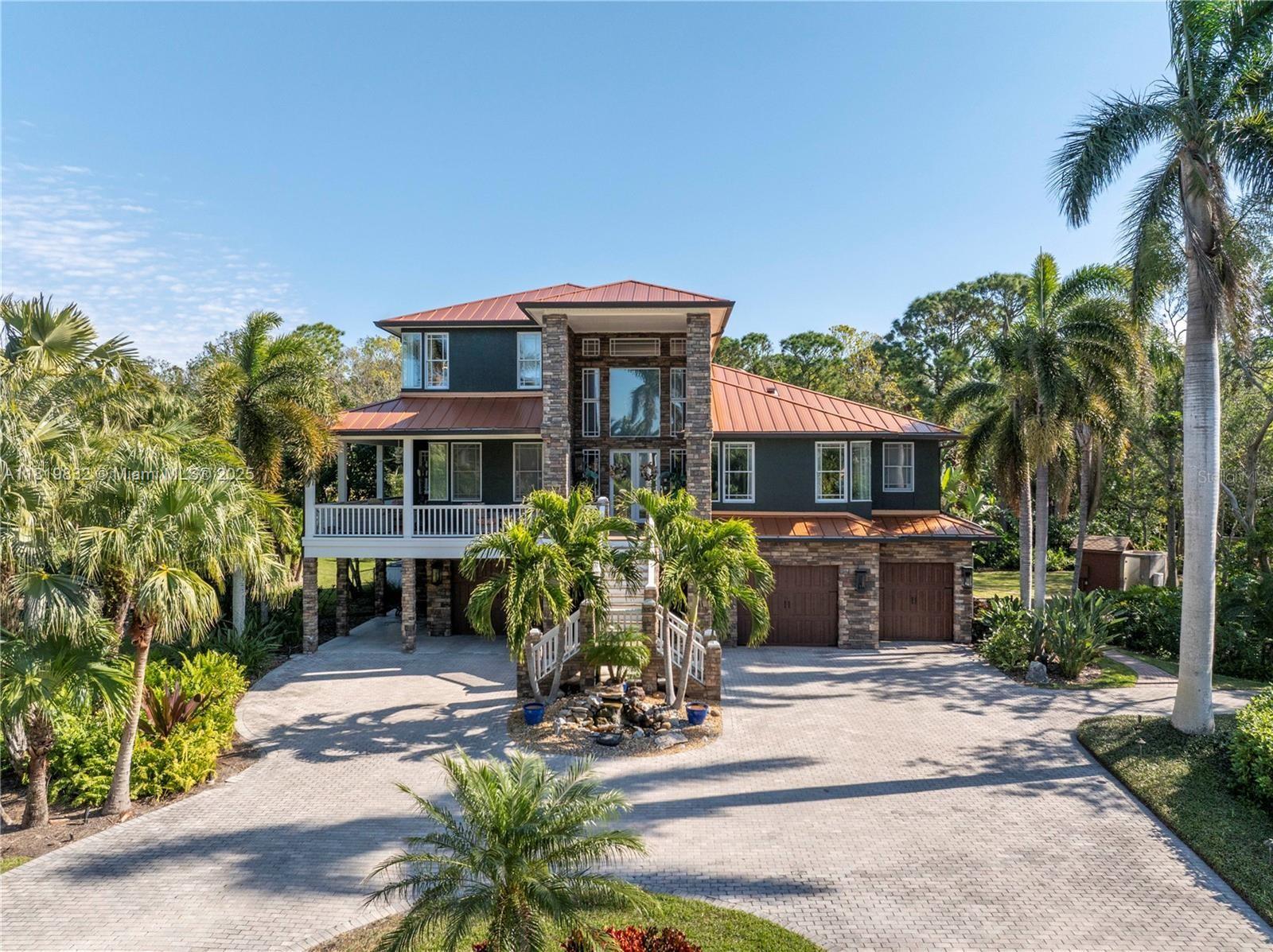 HIDDEN GEM IN A QUIET MID-COUNTY COMMUNITY! A grand circular driveway & Zen Garden gazebo welcome you to this 2-acre estate. The 21-ft foyer opens to hardwood & travertine floors, 10-ft ceilings, & elegant finishes. The chef’s kitchen boasts granite counters, antique cream cabinets, island, pantry, breakfast bar, & top appliances with gas cooking. The Great Room features a stone gas fireplace & 18-ft vaulted ceilings. A 53-ft balcony overlooks a subtropical backyard. Two studio-style bedroom suites with full kitchens on the first level. The master suite has a spacious bedroom, gas fireplace, sitting area, 27-ft balcony, & luxe bath with dual vanities, jetted tub, & marble shower. Enjoy a PebbleTec heated pool, hot tub, waterfalls, sauna, & more. Ample parking for boats, RVs, or cars.