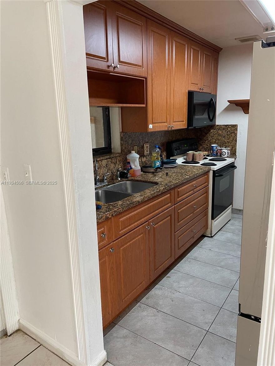 Charming 3-bedroom, 1-bath home in a great Miami location! This property offers excellent potential and is priced to sell quickly. Features include an upgraded kitchen, new refrigerator, impact windows, and a 7-year-old roof. Home needs some TLC, making it a perfect opportunity for investors or buyers looking to add their personal touch. Conveniently located near major roads, shopping, and schools. Dont miss this great value!