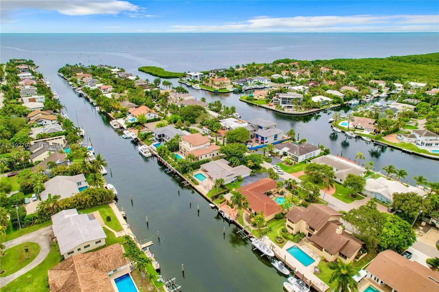 Prime location, Miami waterfront home with endless possibilities and NO BRIDGES to Biscayne Bay. Lowest priced home without bridges and ocean access in South Dade. Longtime owner has meticulously kept this beautiful home that sits on 100' of seawall. Home features three large bedrooms and two bathrooms inside with a third half cabana bathroom for the pool. Primary bedroom is oversized with an expansive bathroom and walk-in closet. The roof was replaced in 2016. This is South Florida living at its best. Come see this boater's paradise!