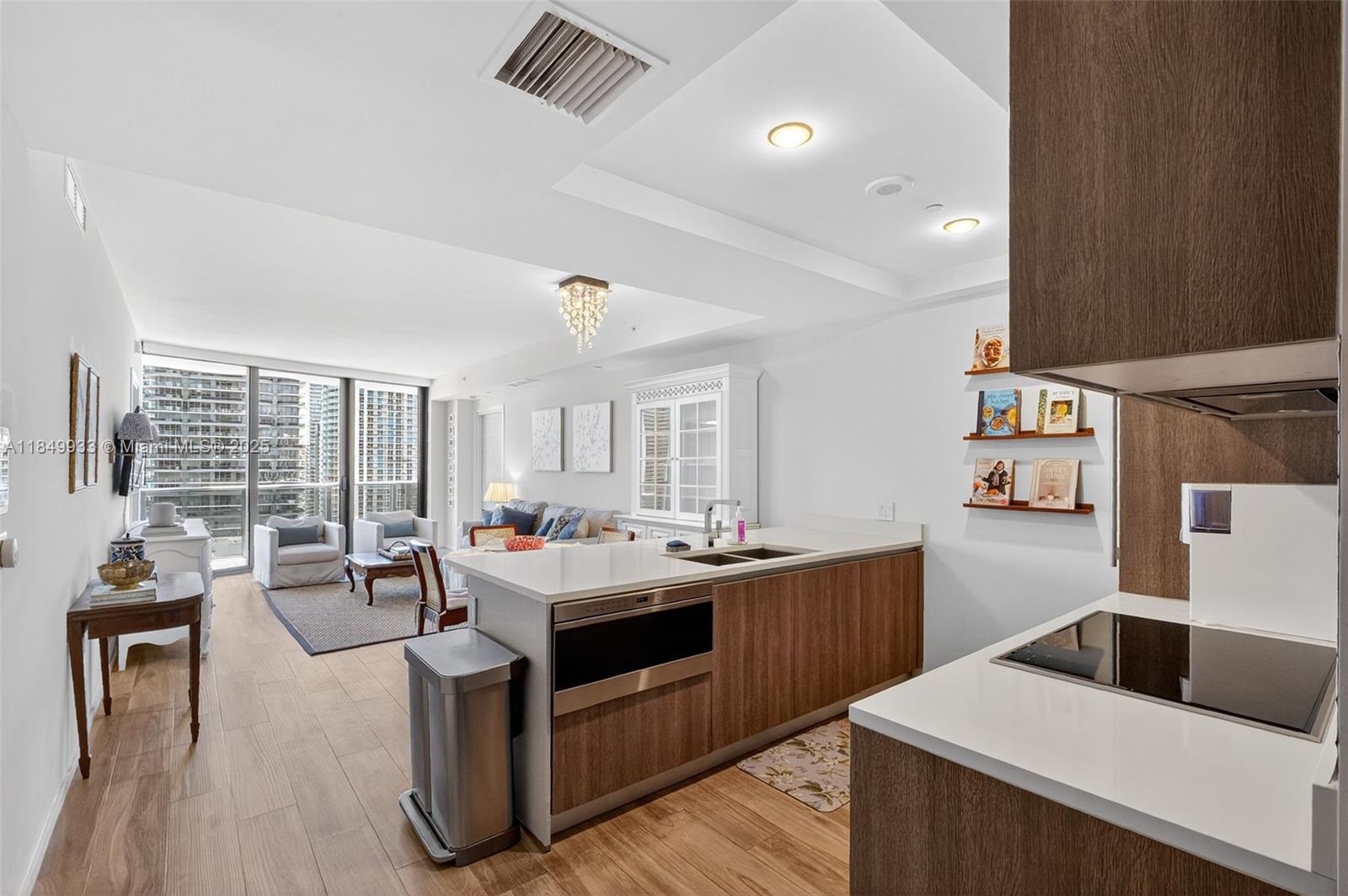 Experience elevated living at SLS Lux Brickell in Miami’s vibrant Brickell neighborhood. Positioned across from Brickell City Centre, this 2-bedroom plus den, 2.5-bath condo offers stunning city and bay views. The residence features a private elevator foyer, sleek interiors, high ceilings, impact windows, and an Italian kitchen with top appliances, European cabinetry, and quartz countertops. Both bedrooms have en-suite baths. Enjoy resort-style pools, a rooftop pool, fitness center, spa, on-site restaurant, 24-hour valet, and concierge. Step outside to luxury boutiques, dining, transit, and Miami’s financial district. This residence blends sophistication and convenience, ideal for living or investment. Don’t miss this rare opportunity to own in Brickell's most prestigious​​‌​​​​‌​‌​​​‌‌​​​‌‌‌​​‌​​‌‌​​​​ building.
