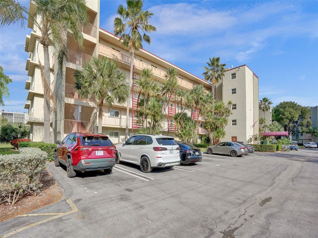 Photo of 2106 S Cypress Bend Dr #203, Pompano Beach, FL 33069 (MLS # A11561786)