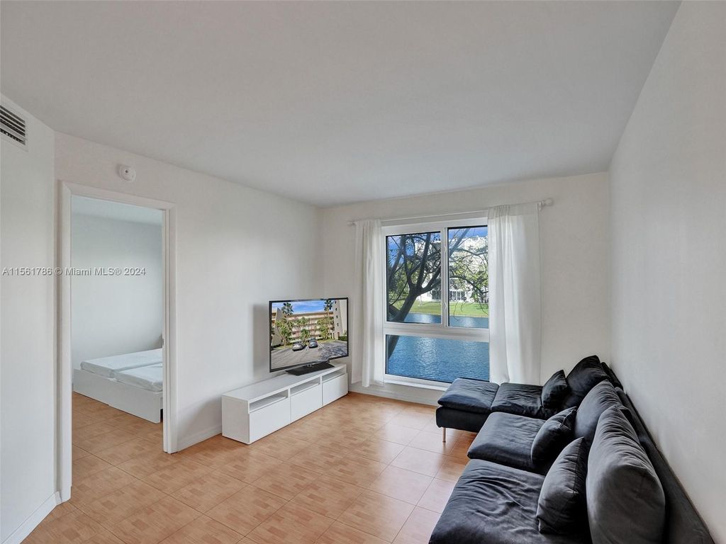Photo of 2106 S Cypress Bend Dr #203, Pompano Beach, FL 33069 (MLS # A11561786)