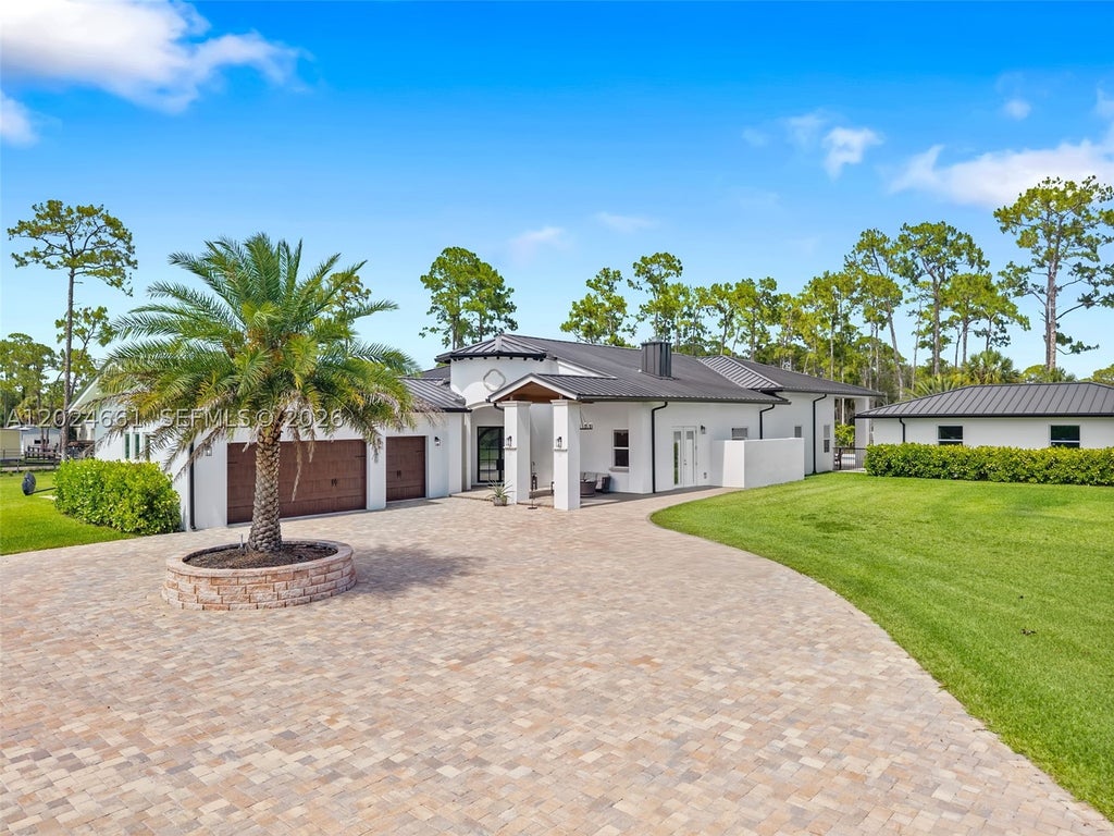 Photo of 2798 Palm Deer Dr, Loxahatchee, FL 33470 (MLS # A12024661)