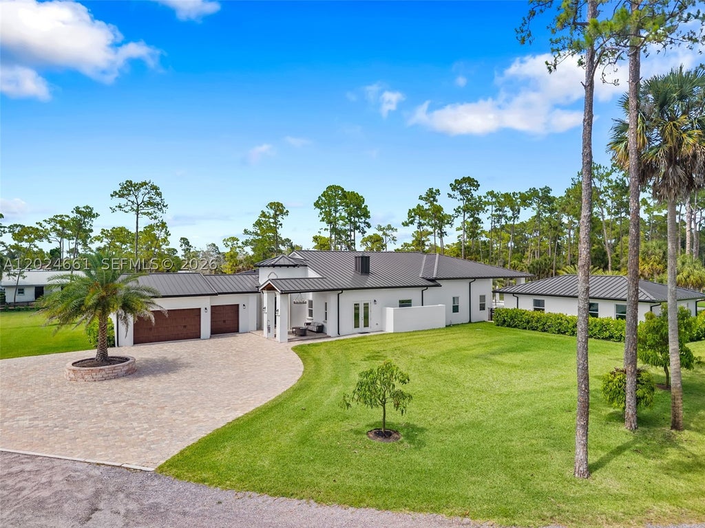 Photo of 2798 Palm Deer Dr, Loxahatchee, FL 33470 (MLS # A12024661)