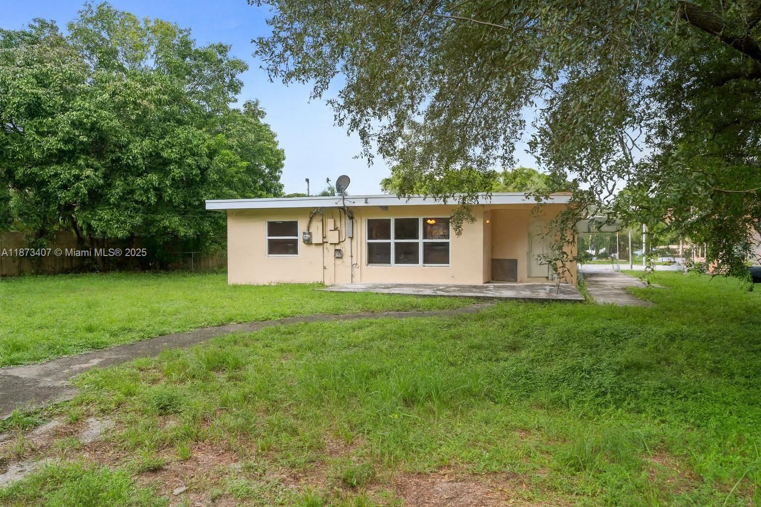 Excellent investment opportunity in Lauderdale Manors! This 4-bed, 2-bath home offers 1,410 sq ft of living space on a large 0.30-acre lot on a quiet cul de sac. With a split-bedroom layout, tile flooring throughout, indoor laundry, and a covered carport, the property is well-suited for rental income or future resale. The fenced yard adds privacy and appeal, while the location provides easy access to downtown Fort Lauderdale, major highways, and beaches. Ideal for investors seeking strong rental demand and long-term growth potential.