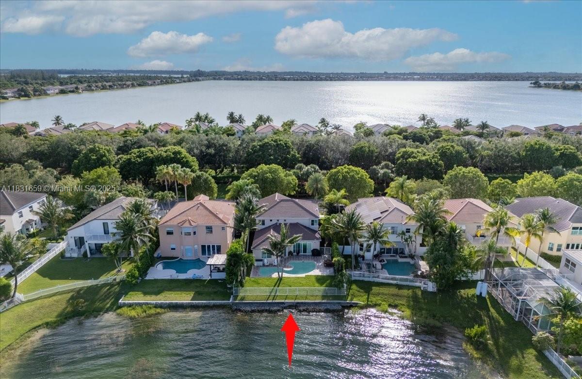 Lakefront living in Riviera Isles! Wake up to stunning water views from both the primary suite and living room. The backyard is a tropical retreat with a pool, mango and coconut trees, and tranquil lake scenery. Inside, enjoy California Closets, RH lighting, impact windows and doors, plantation shutters, and a spacious layout filled with natural light. Located in a gated community with 24/7 security, resort-style amenities including tennis courts, gym, pool, clubhouse, and top-rated schools nearby.